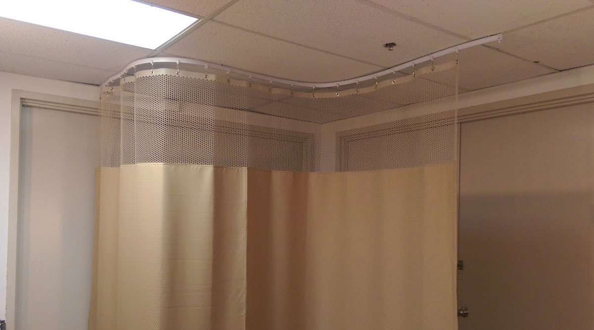Image of a Commercial curtain track curved system in a doctors office